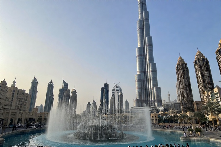 The Burj Khalifa towering over Downtown Dubai with dancing fountains at its base.